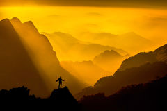 silhouette-man-top-mountain-sunset-conceptual-sce-scene-48015806